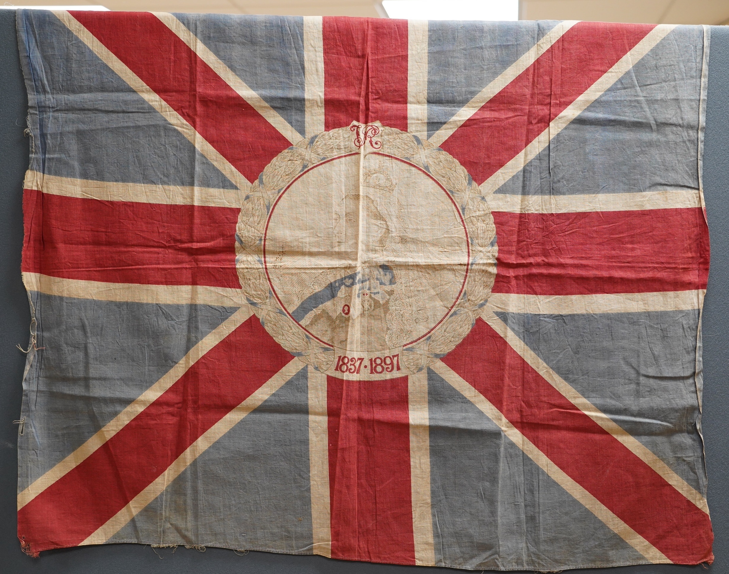 Eight mostly mid 20th century Union Jack flags, one celebrating Queen Victoria’s Diamond Jubilee, together with a Saint George’s cross and a string of Union flag bunting. Condition - poor to good